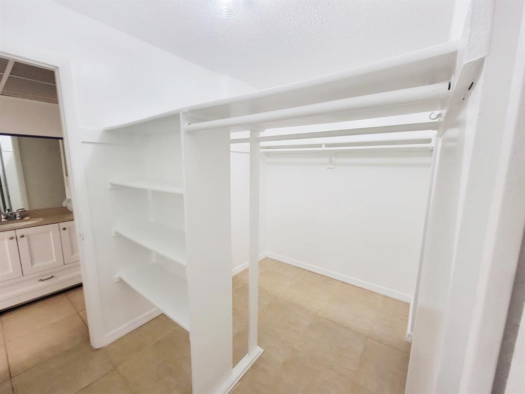 2800 Northwest 56th Avenue, Unit E407 Lauderhill, FL 33313 - Photo 9 of 15 a view of an empty walk in closet