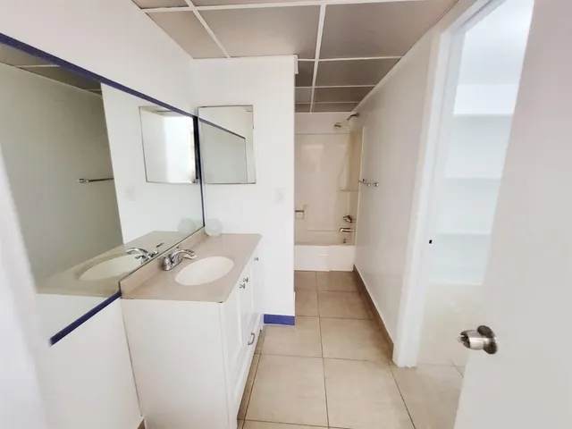 a bathroom with a sink and mirror