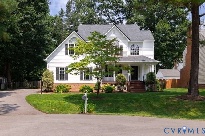 6118 Springwood Road Chester, VA 23831 - Photo 4 of 38 White siding exterior with a dark shingle roof, fe