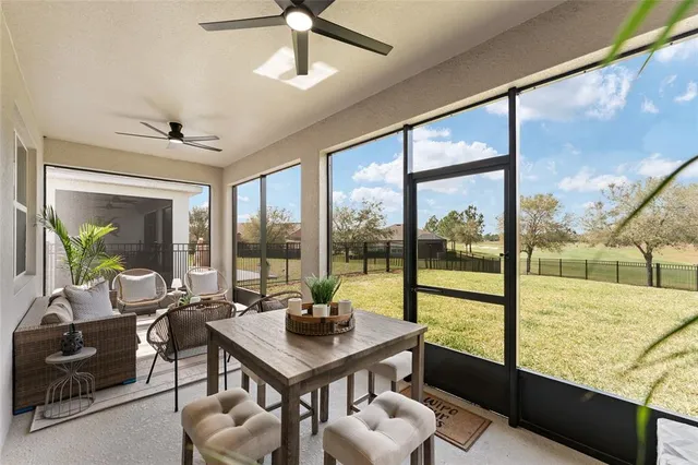 a view of a house with yard and sitting area