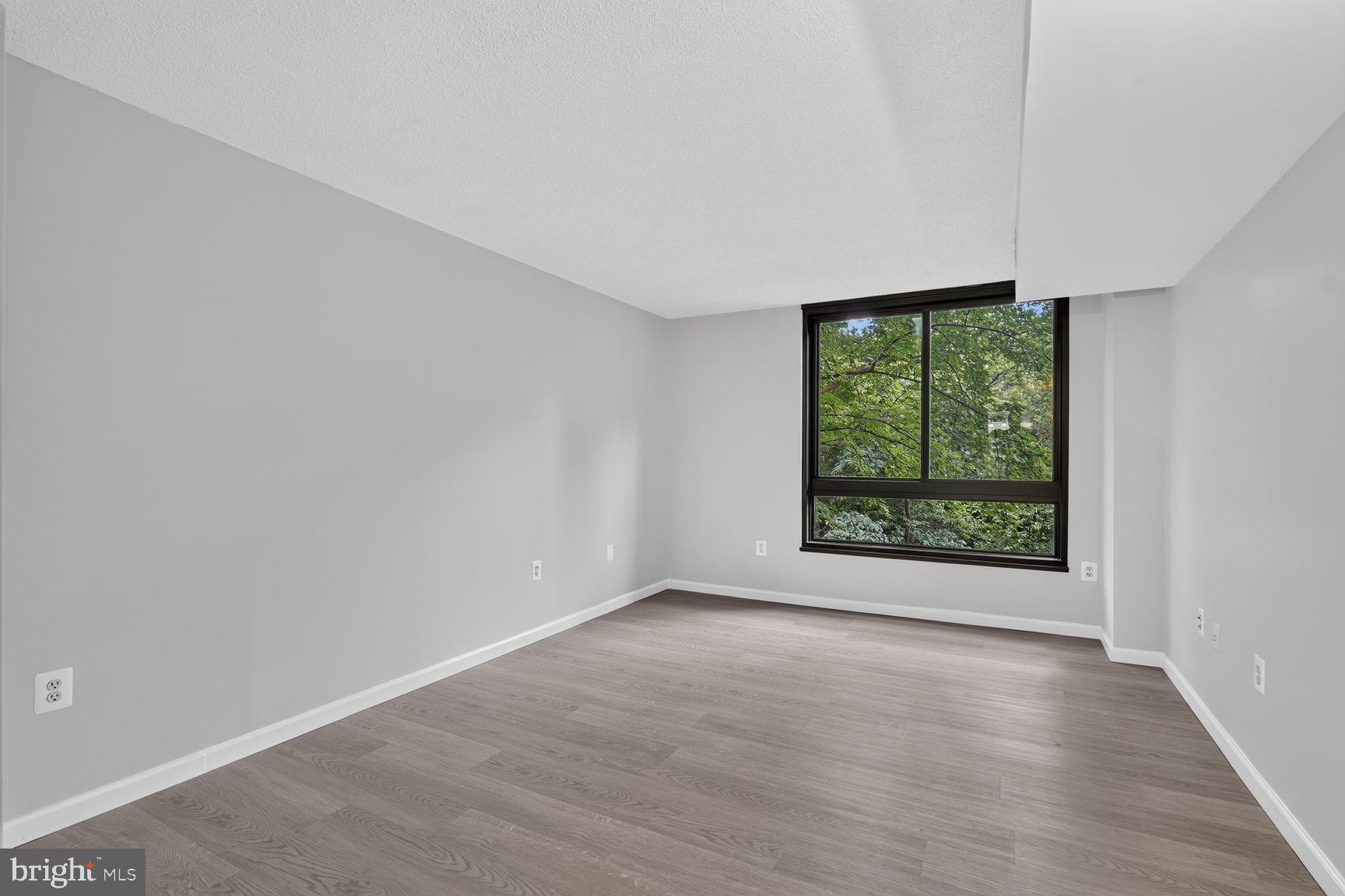 1808 Old Meadow Road, Unit 601 McLean, VA 22102 - Photo 11 of 19 Bedroom with Window looking at Trees