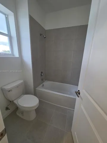a view of a livingroom with table and chair