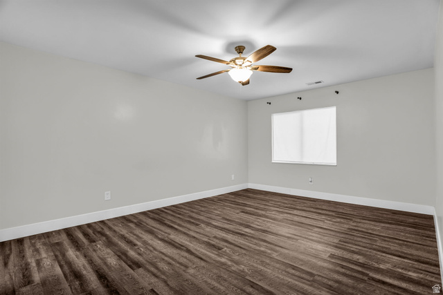 1836 West 800 North Mapleton, UT 84663 - Photo 28 of 38 Spare room featuring dark wood finished floors and ceiling fan