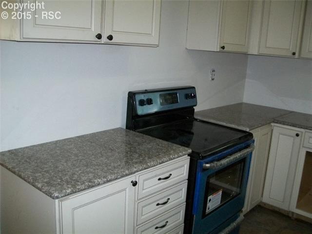 612 Sunset Road Colorado Springs, CO 80909 - Photo 6 of 27 New Kitchen Cabinets / Appliances / Counter Tops / Tile Flooring