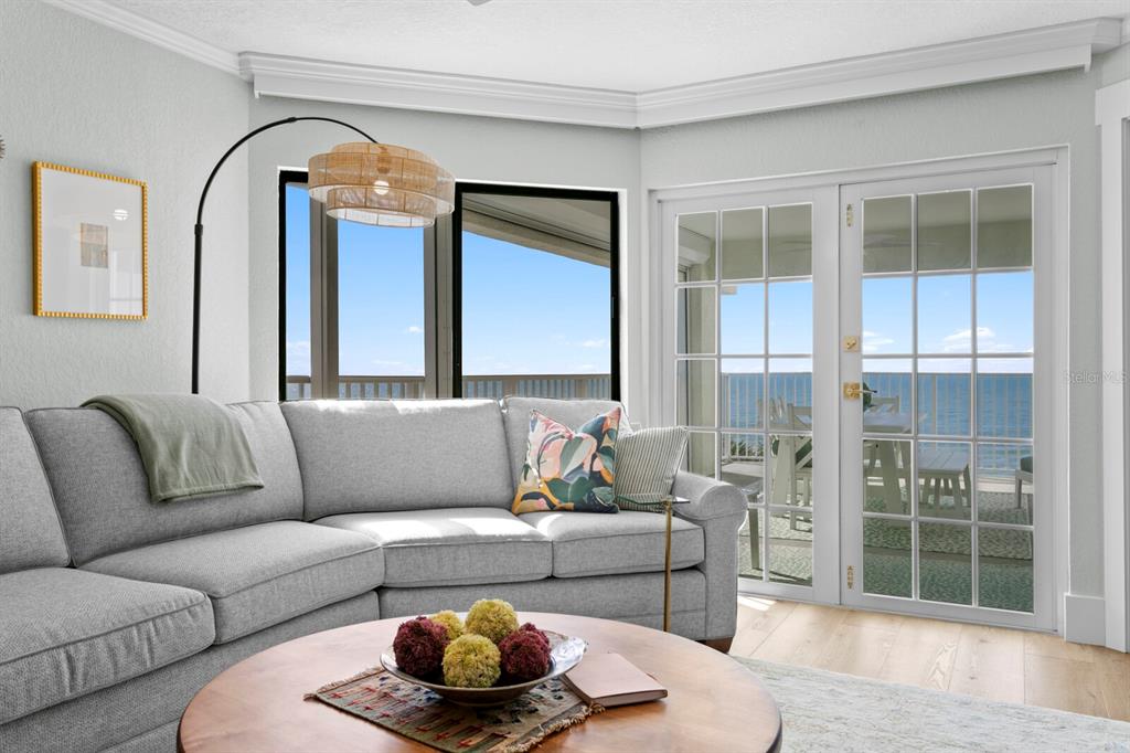 16332 Gulf Boulevard, Unit 3B Redington Beach, FL 33708 - Photo 31 of 91 a living room with furniture and a large window