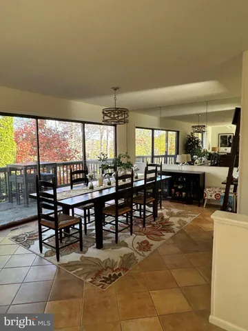 a view of a dining area with furniture and window