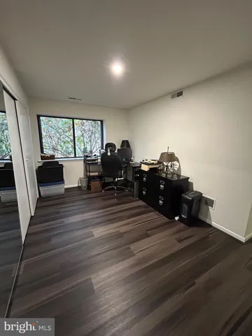 a living room with furniture and large windows