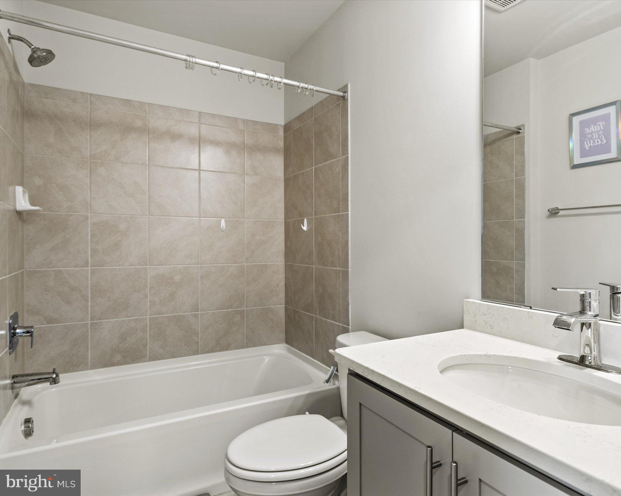 6610 Bullrush Court Clinton, MD 20735 - Photo 15 of 22 a bathroom with a sink a toilet and a bathtub