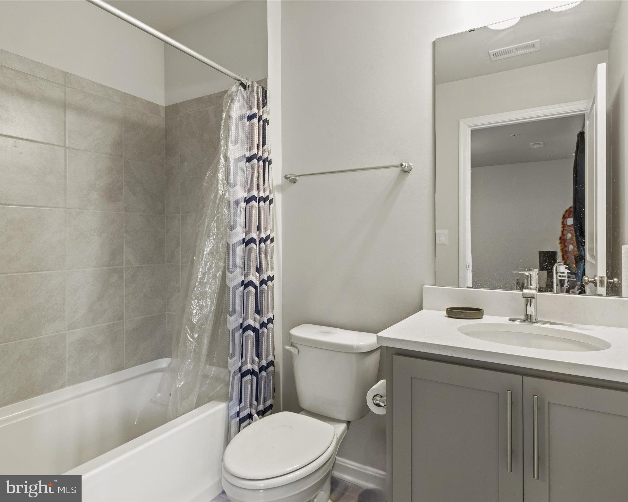 6610 Bullrush Court Clinton, MD 20735 - Photo 18 of 22 a bathroom with a sink toilet and shower