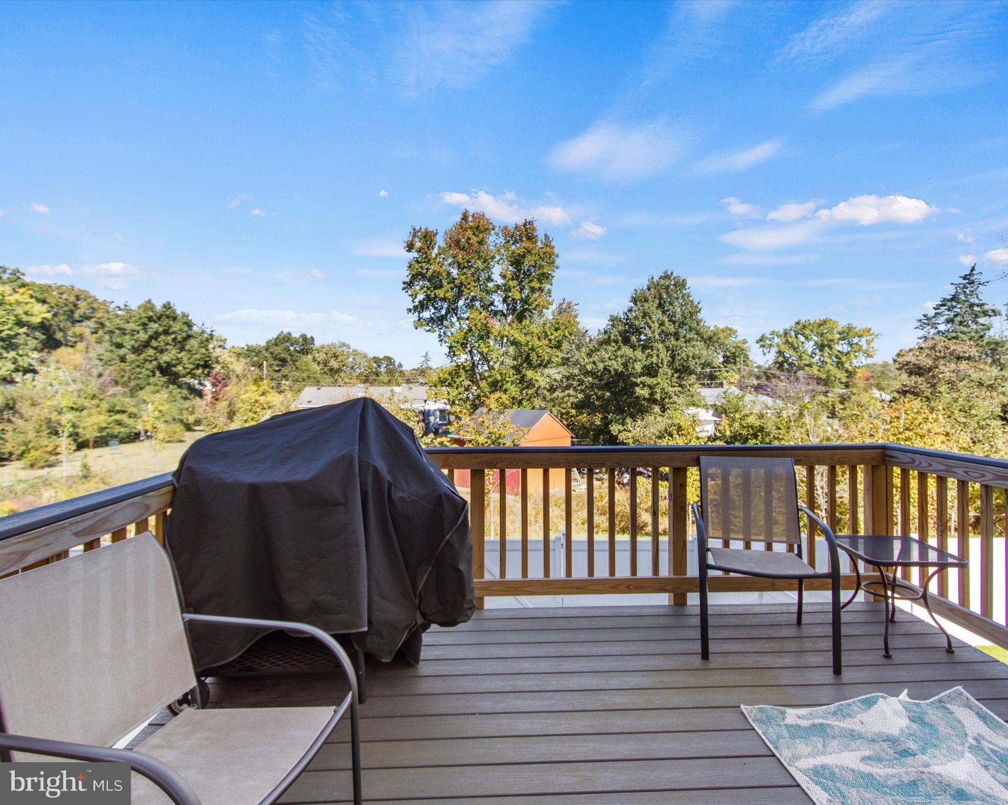 6610 Bullrush Court Clinton, MD 20735 - Photo 20 of 22 a balcony with wooden floor and outdoor seating