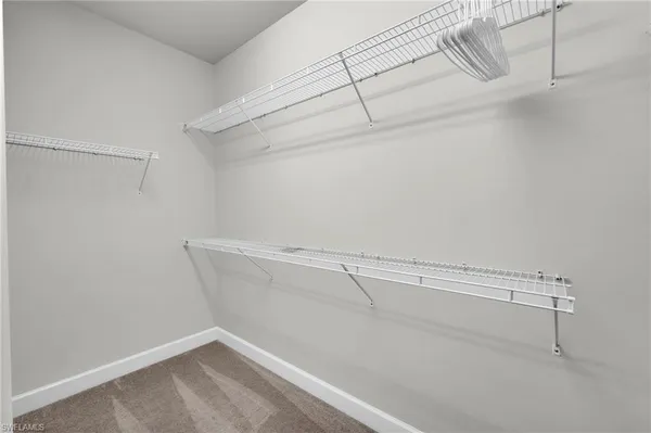 a view of a room with racks on the wall