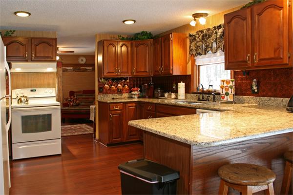 207 Hubbardston Road Templeton, MA 01468 - Photo 3 of 19 a kitchen with a stove a sink and a refrigerator