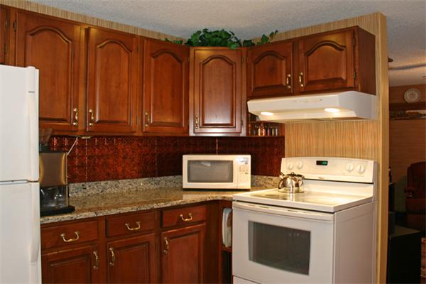 207 Hubbardston Road Templeton, MA 01468 - Photo 4 of 19 a kitchen with stainless steel appliances granite countertop a refrigerator and a stove top oven