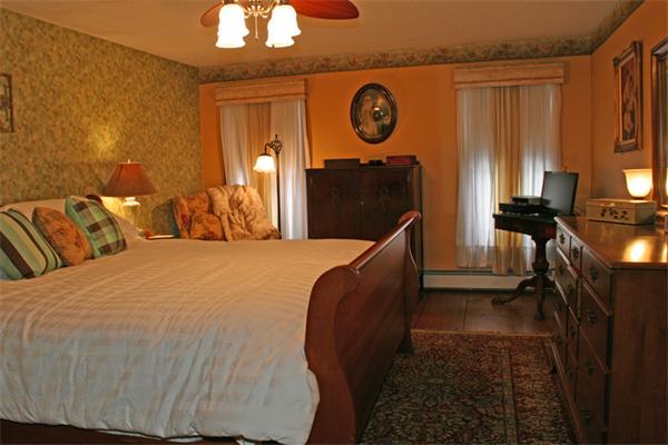 207 Hubbardston Road Templeton, MA 01468 - Photo 9 of 19 a bedroom with a bed and a chandelier