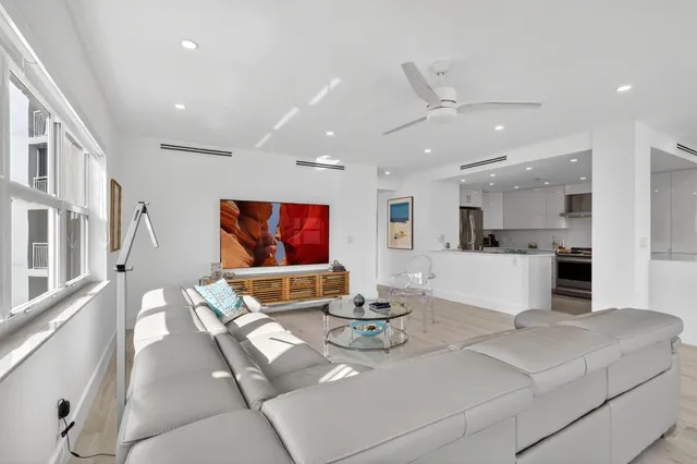 a kitchen with a sink appliances and cabinets