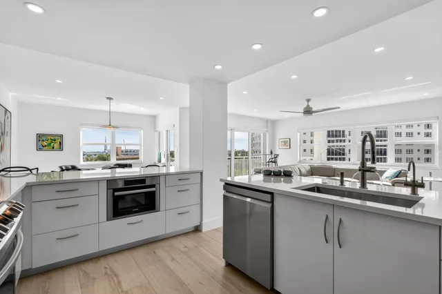 a dining room with furniture wooden floor a rug and a painting