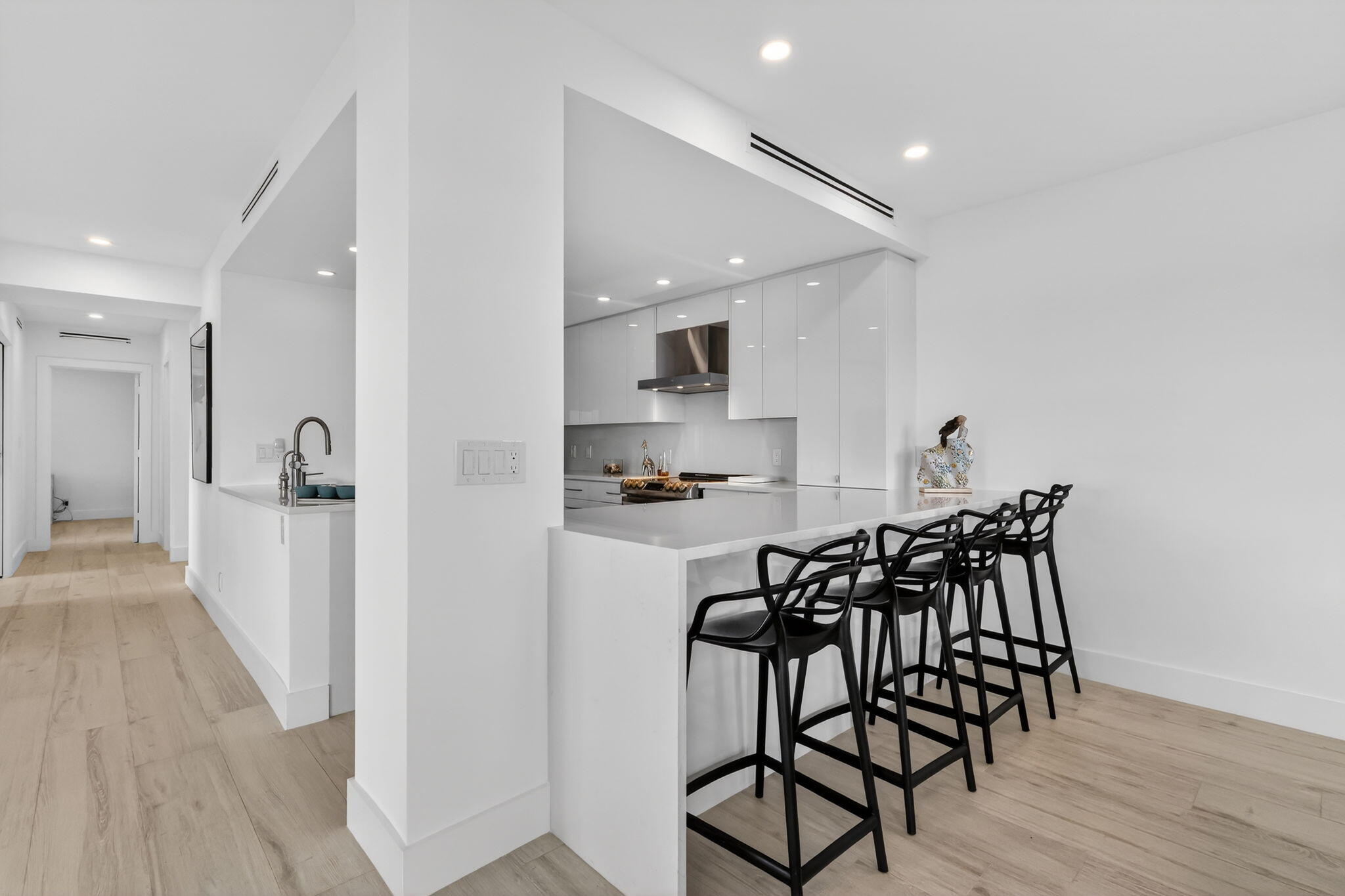 1000 Lowry Street, Unit 6J Delray Beach, FL 33483 - Photo 22 of 63 a view of a dining room with furniture and wooden floor