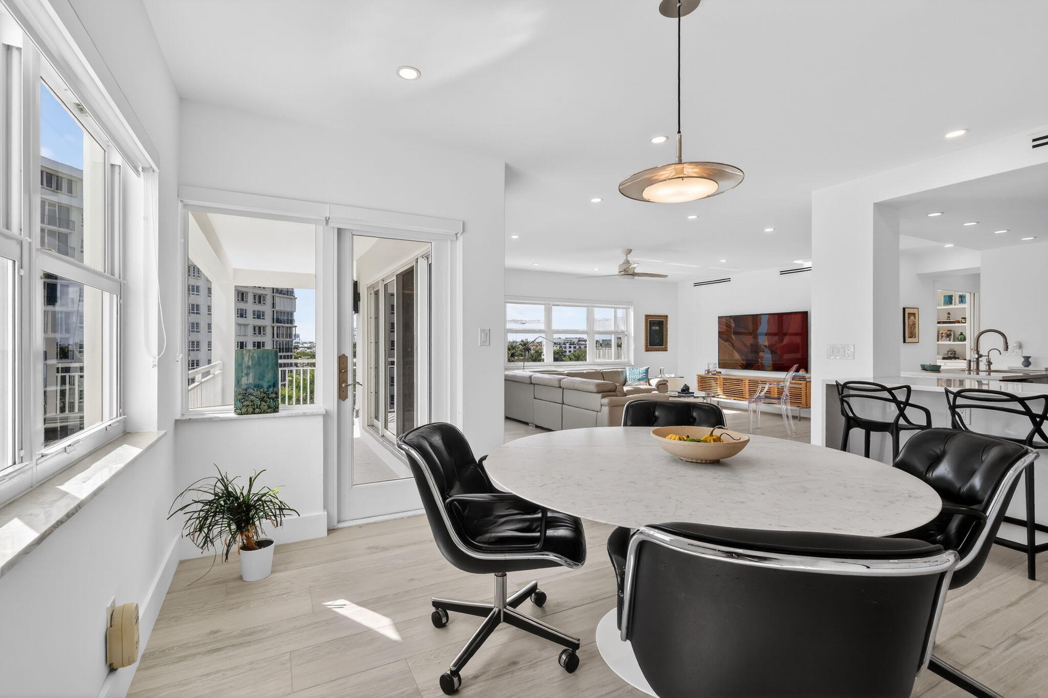 1000 Lowry Street, Unit 6J Delray Beach, FL 33483 - Photo 25 of 63 a view of a dining room with furniture and a chandelier