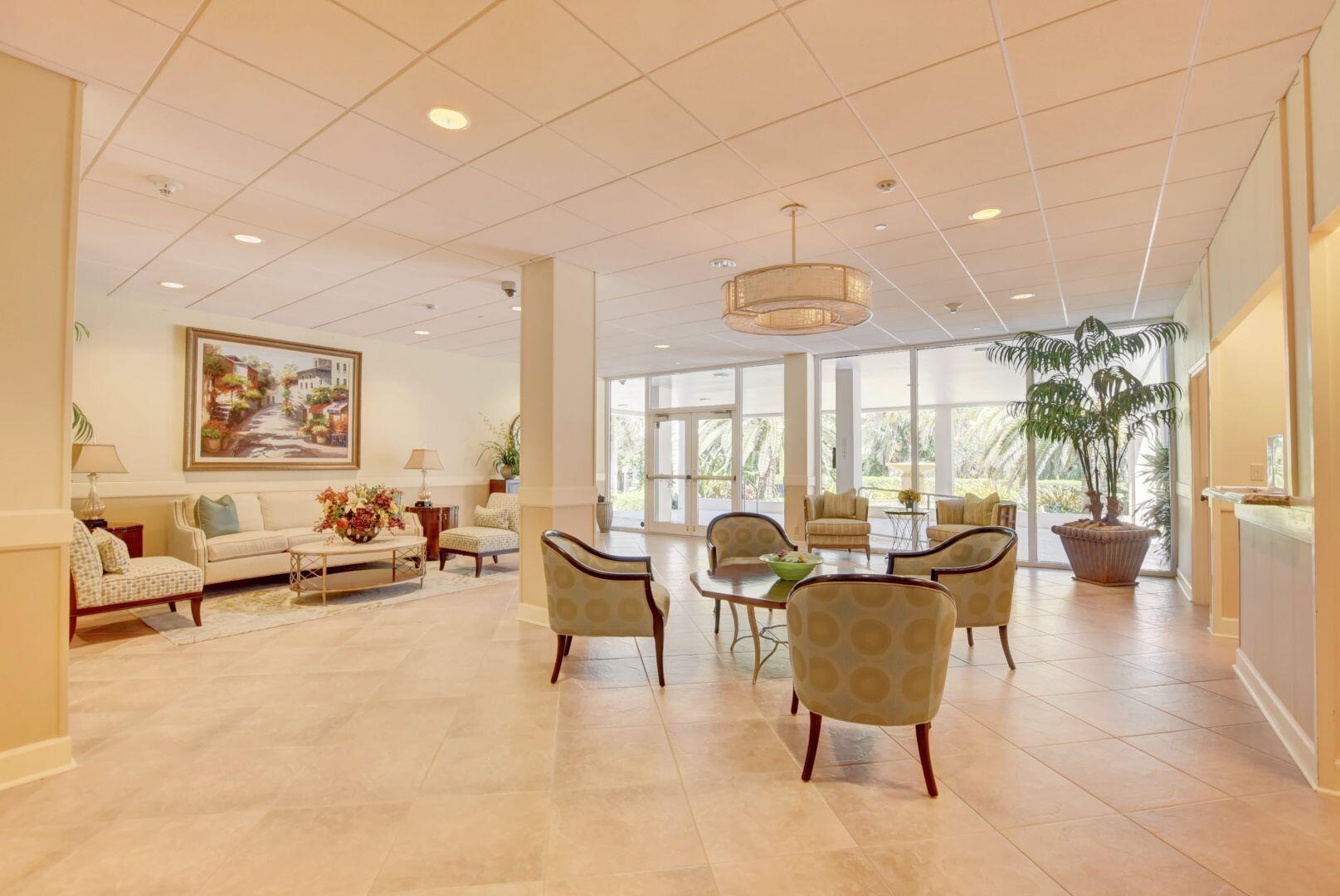 1000 Lowry Street, Unit 6J Delray Beach, FL 33483 - Photo 5 of 63 a living room with furniture and a large window