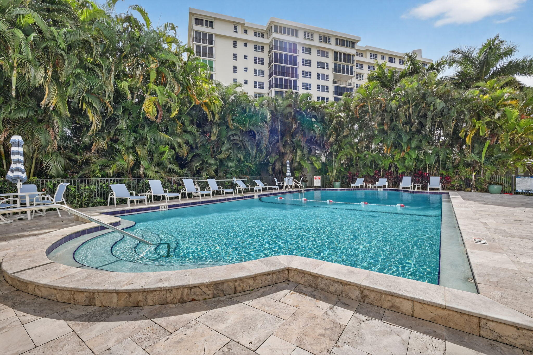 1000 Lowry Street, Unit 6J Delray Beach, FL 33483 - Photo 58 of 63 a view of a swimming pool with a yard