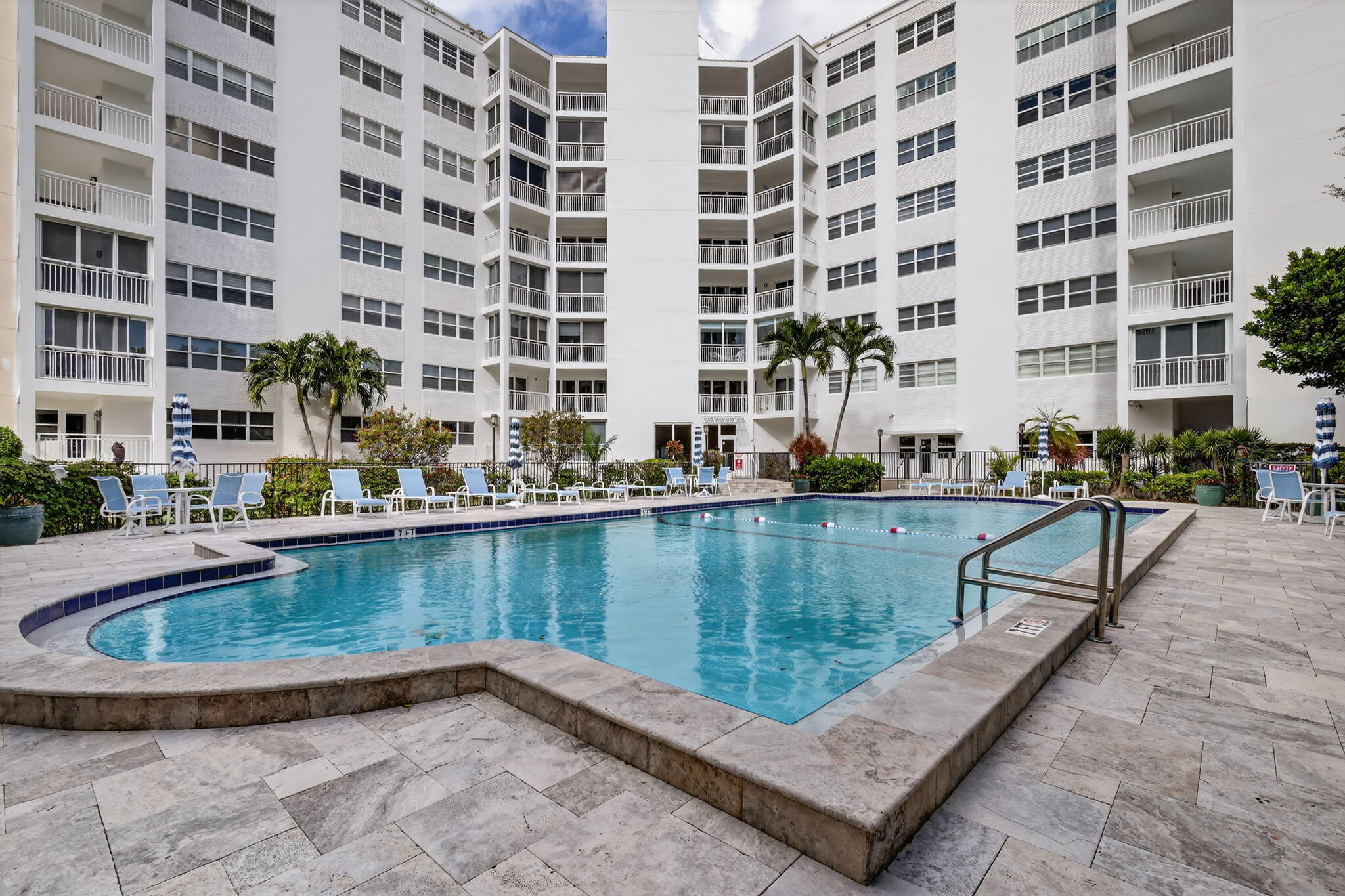 1000 Lowry Street, Unit 6J Delray Beach, FL 33483 - Photo 61 of 63 a view of swimming pool with outdoor seating