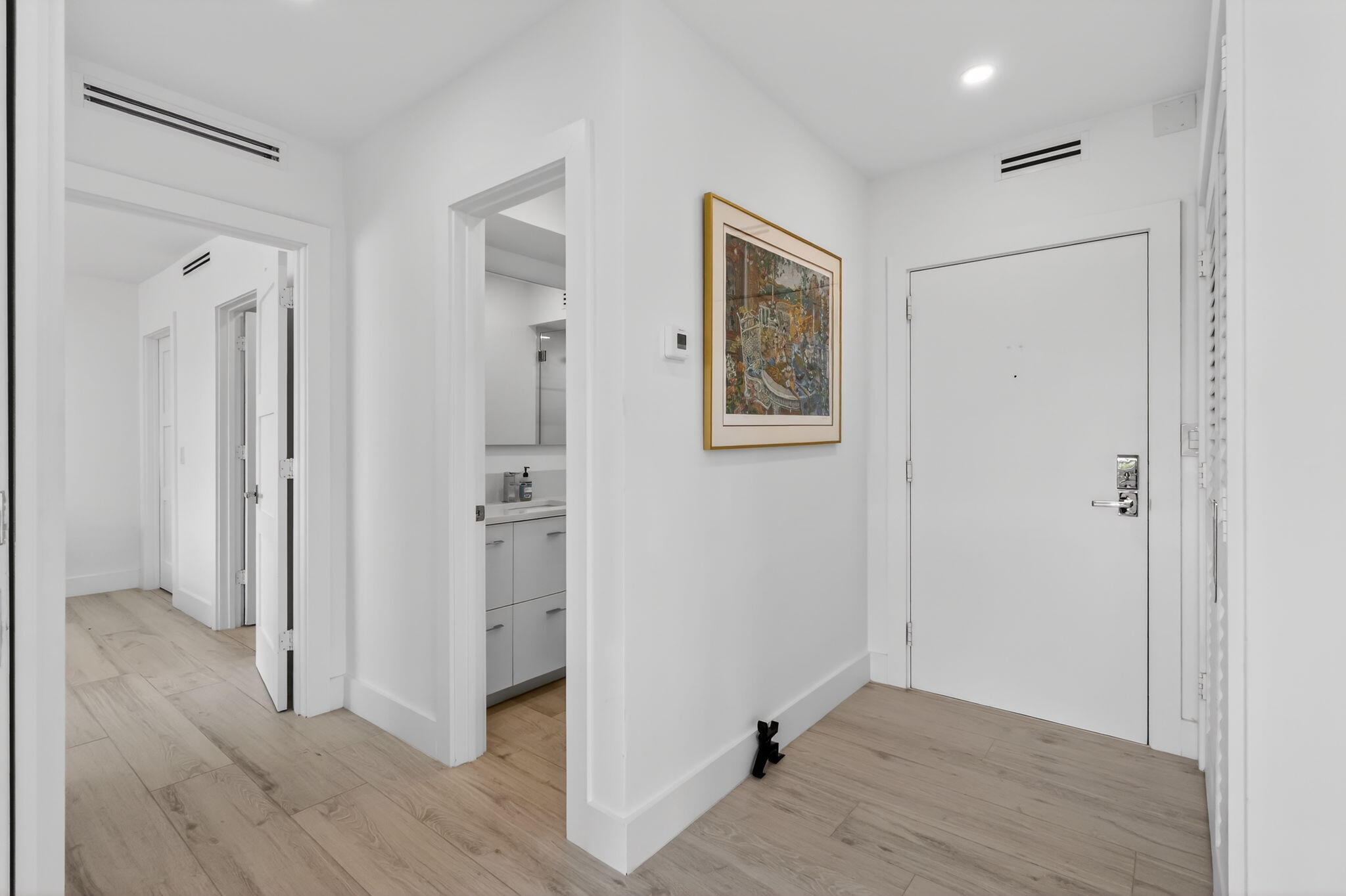 1000 Lowry Street, Unit 6J Delray Beach, FL 33483 - Photo 7 of 63 a view of entryway with wooden floor