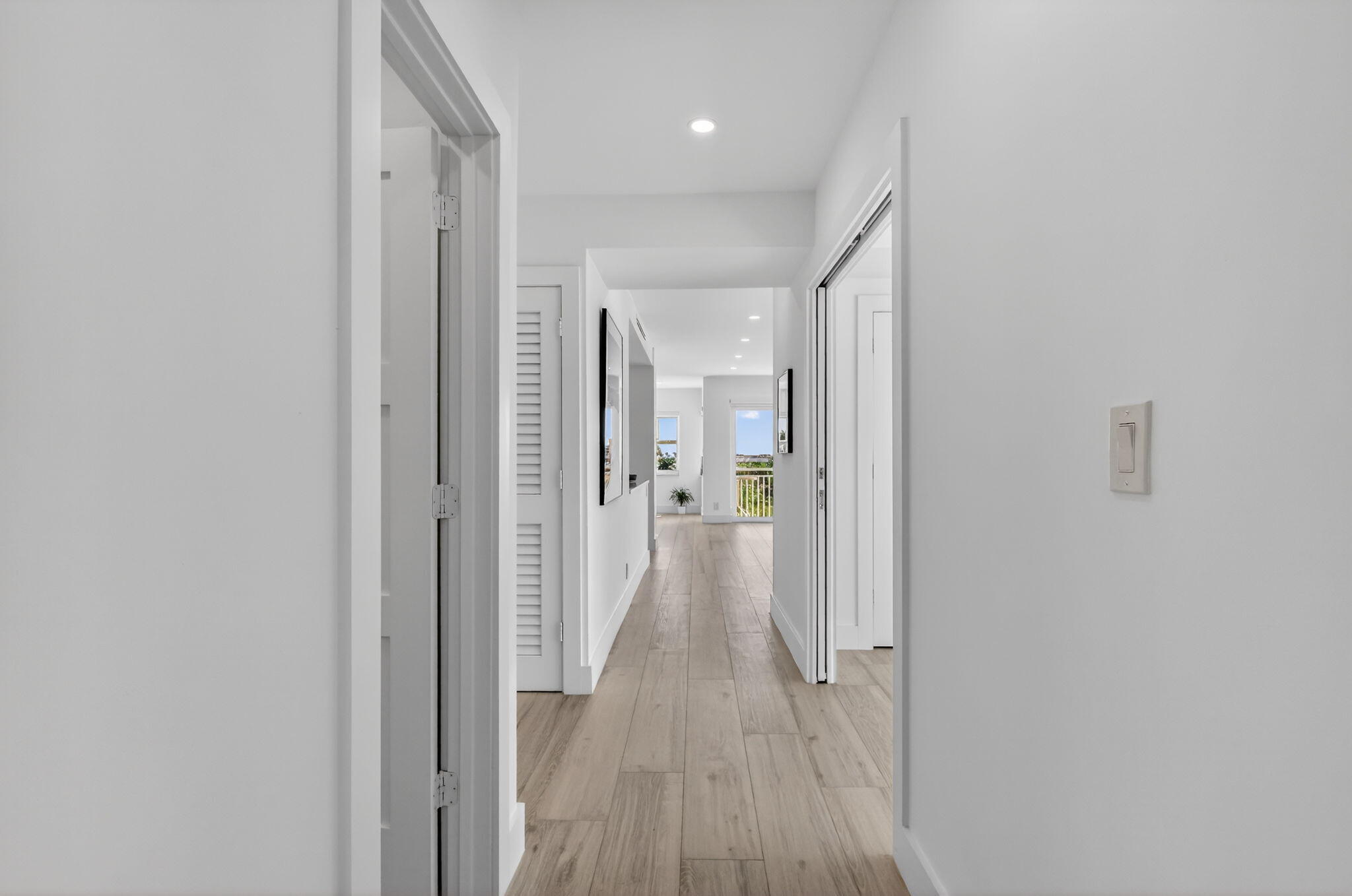 1000 Lowry Street, Unit 6J Delray Beach, FL 33483 - Photo 8 of 63 a view of a hallway with wooden floor