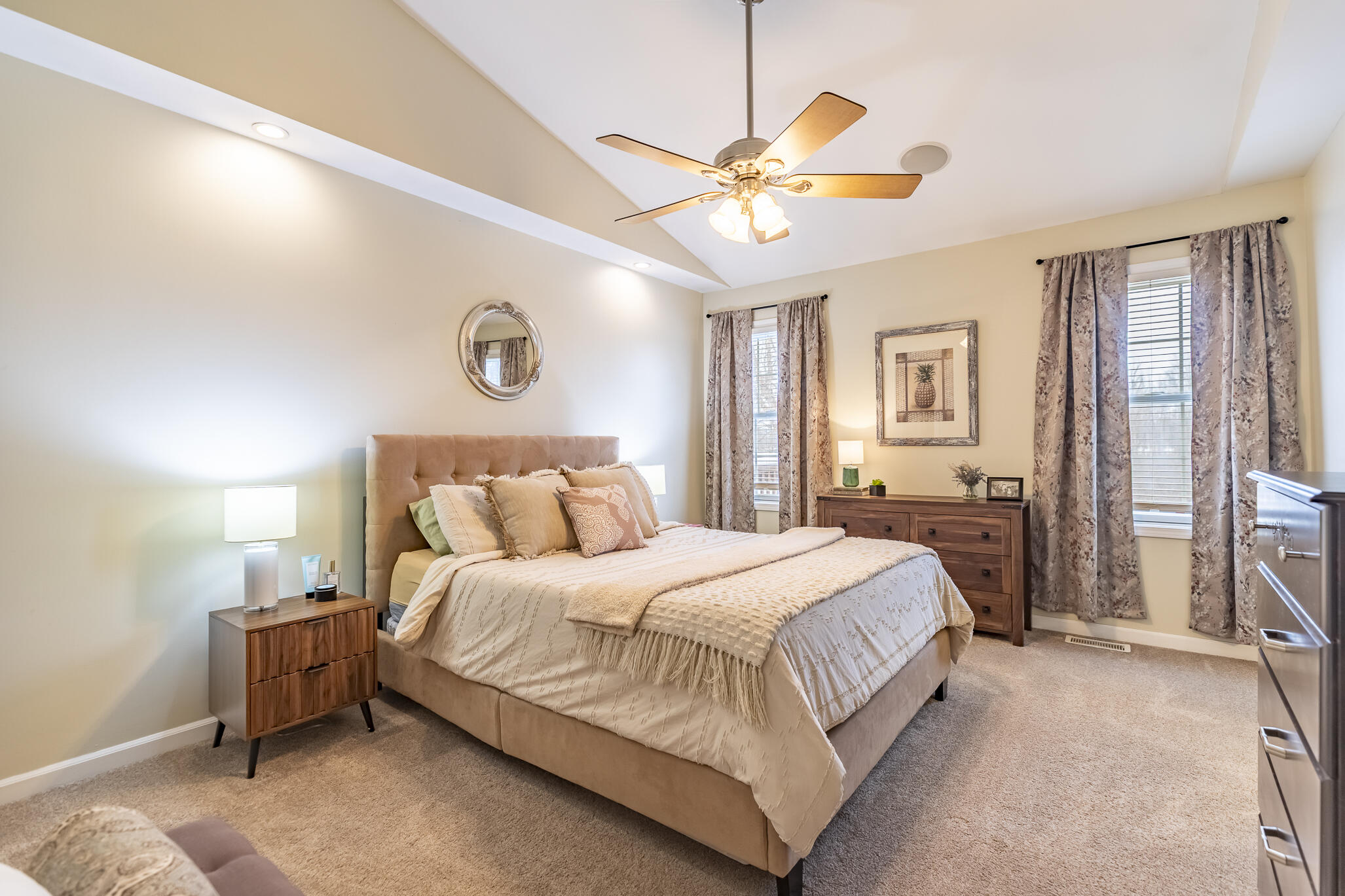 17 Browning Lane Valparaiso, IN 46383 - Photo 20 of 32 a bedroom with a large bed and a chandelier