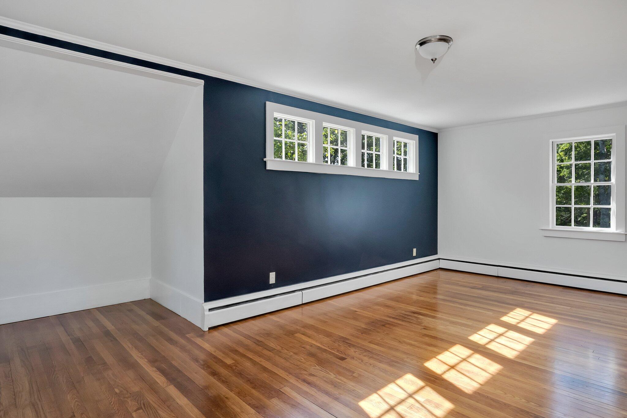 107 Chatham Road Harwich, MA 02645 - Photo 3 of 29 an empty room with wooden floor and windows