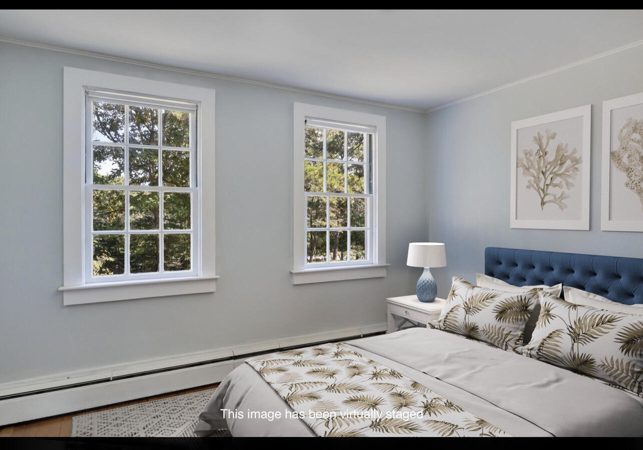 107 Chatham Road Harwich, MA 02645 - Photo 9 of 29 a bedroom with a bed and a window