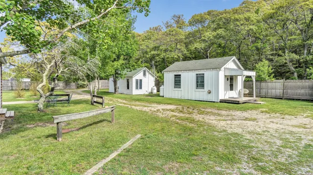 a view of a house with a backyard