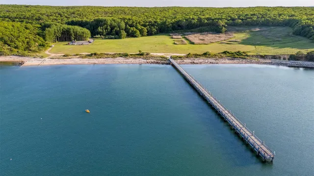 a view of a swimming pool and a yard