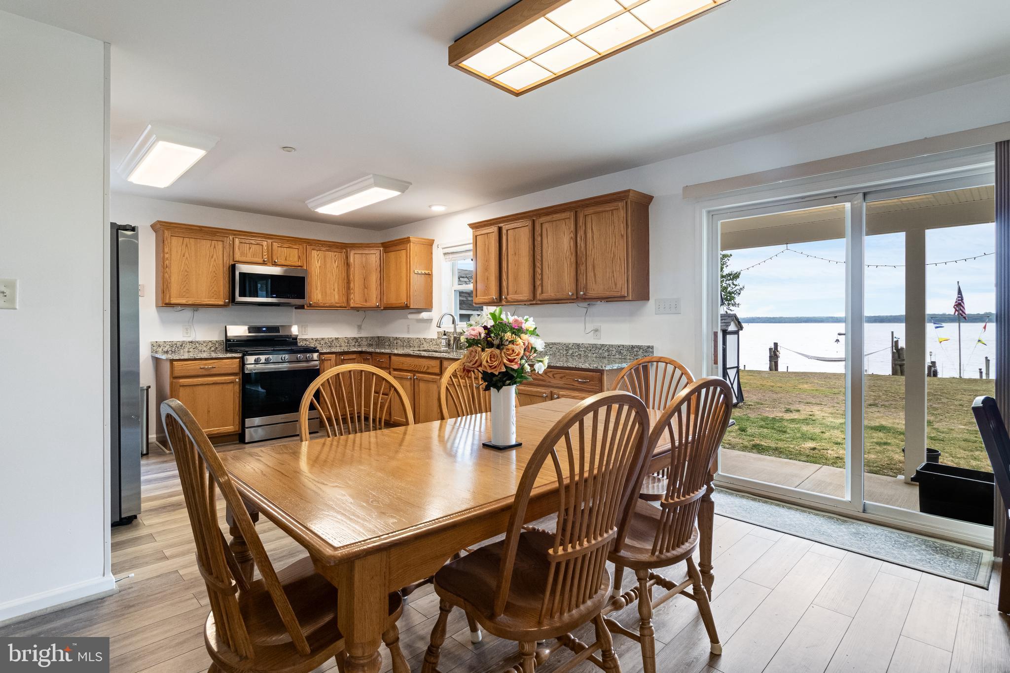 12015 Woodbury Road Nanjemoy, MD 20662 - Photo 32 of 53 a view of a dining room with furniture and a large window