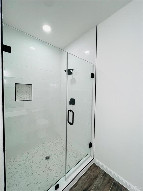 5403 North Crown Point Pharr, TX 78577 - Photo 17 of 30 a bathroom with a glass shower door