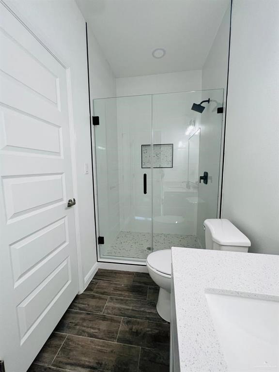 5403 North Crown Point Pharr, TX 78577 - Photo 22 of 30 a bathroom with a sink a toilet and shower