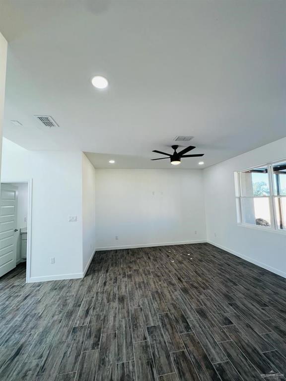 5403 North Crown Point Pharr, TX 78577 - Photo 9 of 30 wooden floor in an empty room with a window
