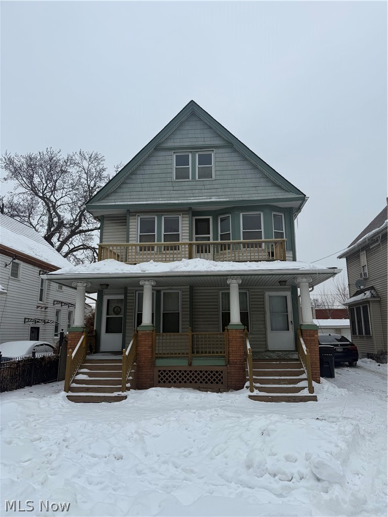 3612 Riverside Avenue Cleveland, OH 44109 - Photo 1 of 22 Two-story dwelling featuring a light-colored siding facade with a prominent peaked roof