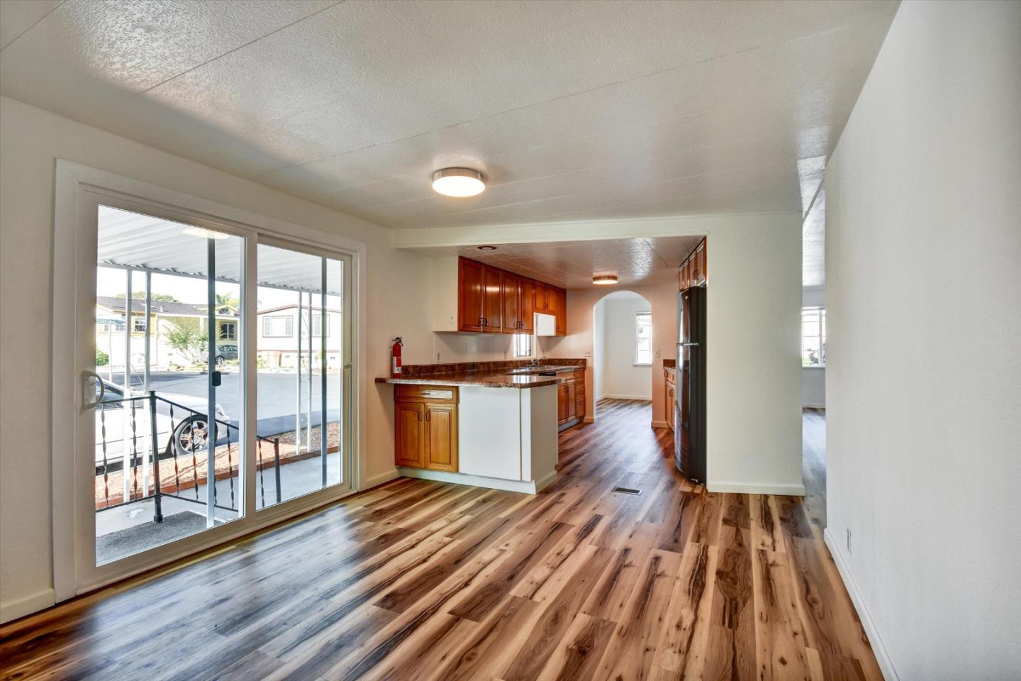 17 Pepperwood Way, Unit 17 Soquel, CA 95073 - Photo 17 of 56 a view of a room with wooden floor and a window