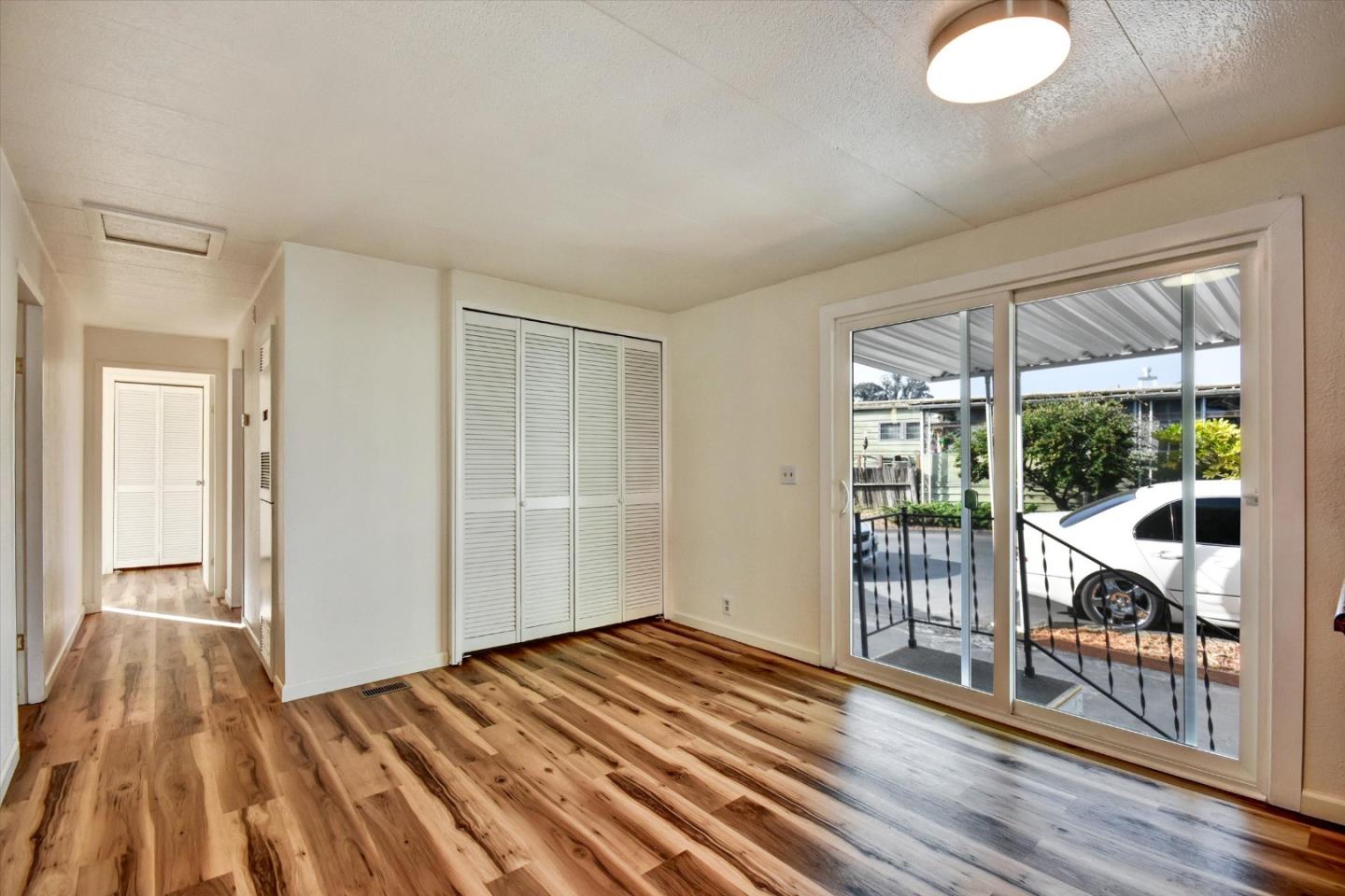 17 Pepperwood Way, Unit 17 Soquel, CA 95073 - Photo 18 of 56 a view of a room with wooden floor and windows