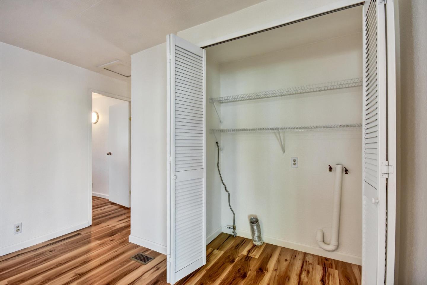 17 Pepperwood Way, Unit 17 Soquel, CA 95073 - Photo 20 of 56 a view of a room with wooden floor and staircase
