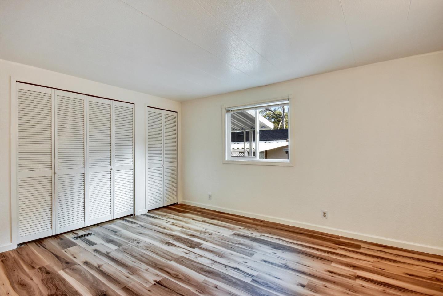 17 Pepperwood Way, Unit 17 Soquel, CA 95073 - Photo 21 of 56 a view of empty room with wooden floor and fan