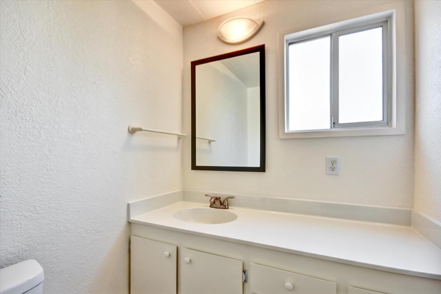 17 Pepperwood Way, Unit 17 Soquel, CA 95073 - Photo 28 of 56 a bathroom with a sink and a mirror