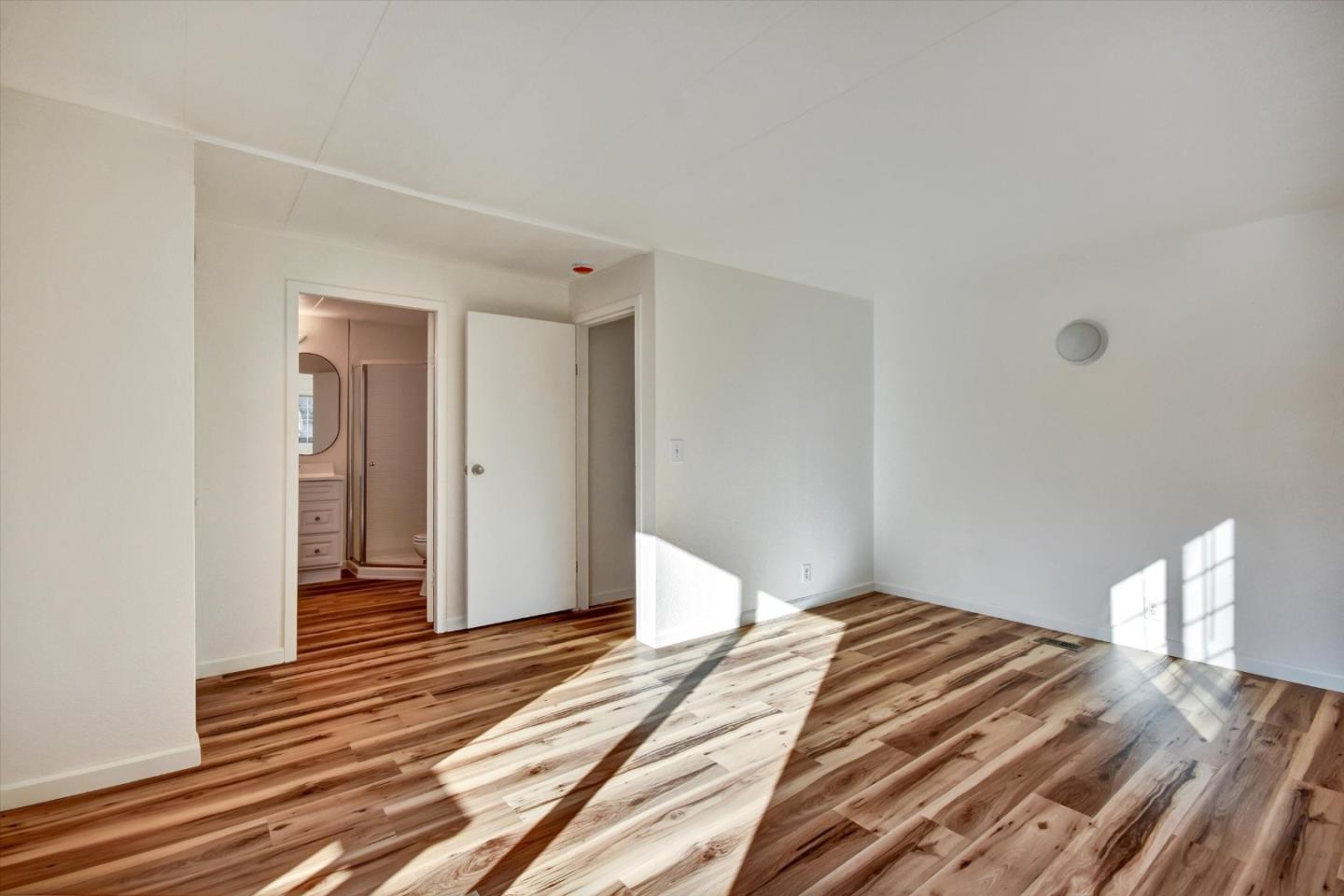 17 Pepperwood Way, Unit 17 Soquel, CA 95073 - Photo 31 of 56 a bedroom with a bed and a dresser