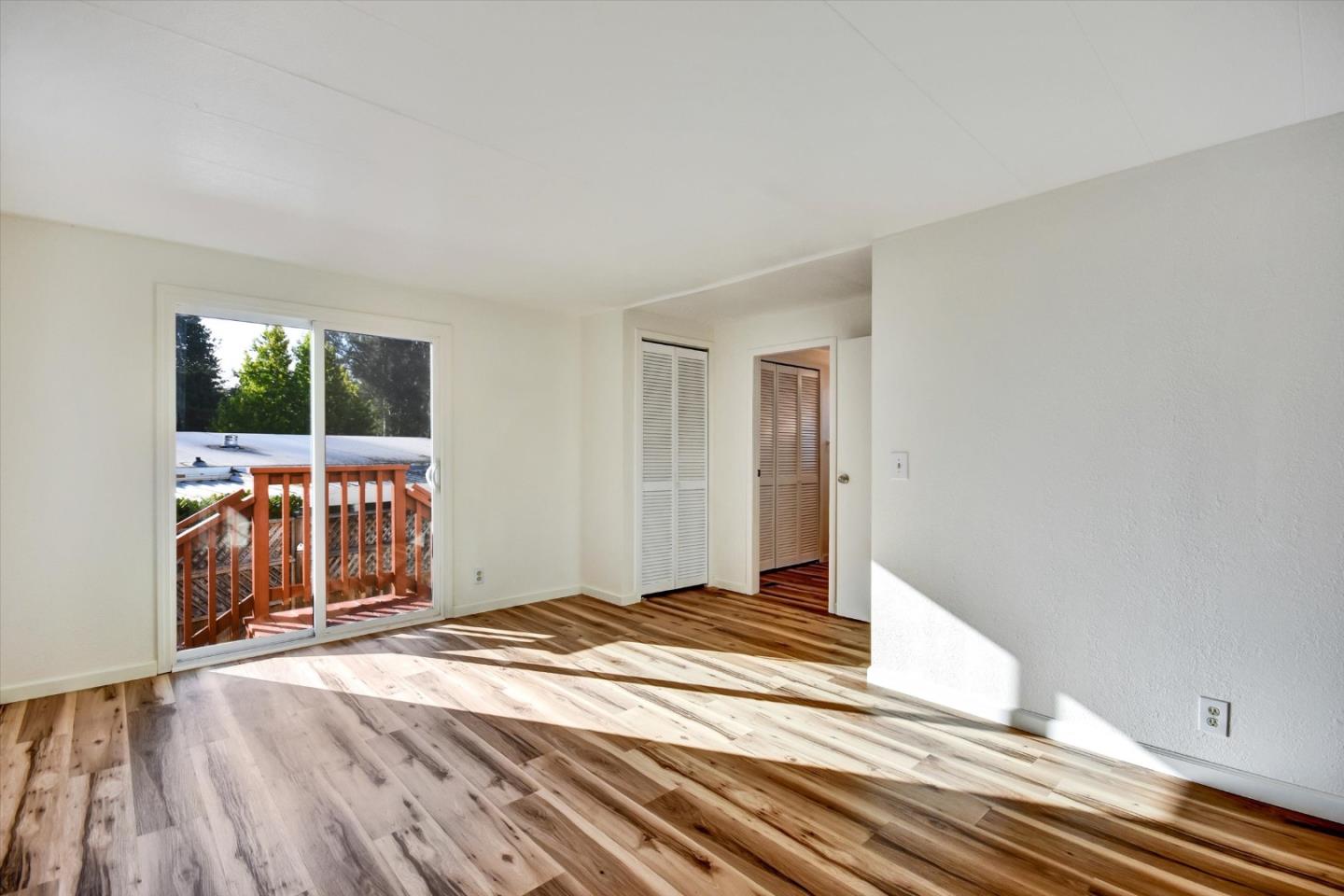 17 Pepperwood Way, Unit 17 Soquel, CA 95073 - Photo 32 of 56 a view of a livingroom with wooden floor and window