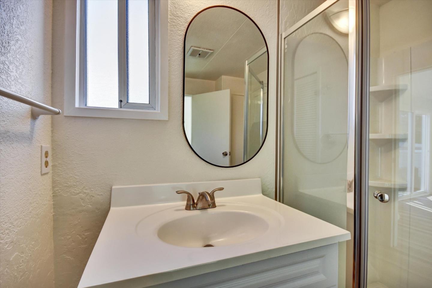 17 Pepperwood Way, Unit 17 Soquel, CA 95073 - Photo 36 of 56 a bathroom with a sink and a mirror