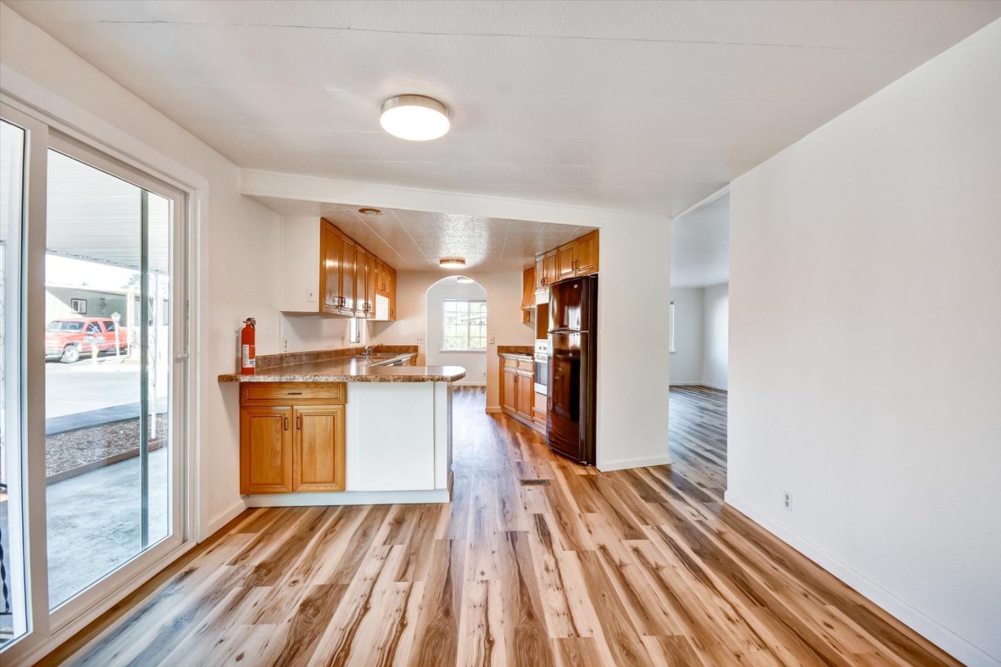17 Pepperwood Way, Unit 17 Soquel, CA 95073 - Photo 45 of 56 a kitchen with stainless steel appliances granite countertop a refrigerator and a sink