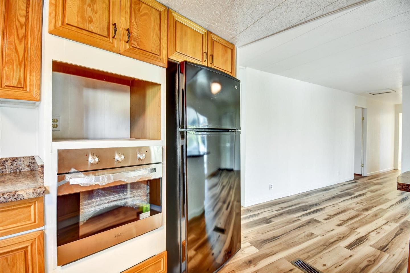 17 Pepperwood Way, Unit 17 Soquel, CA 95073 - Photo 46 of 56 a kitchen with a refrigerator and a stove