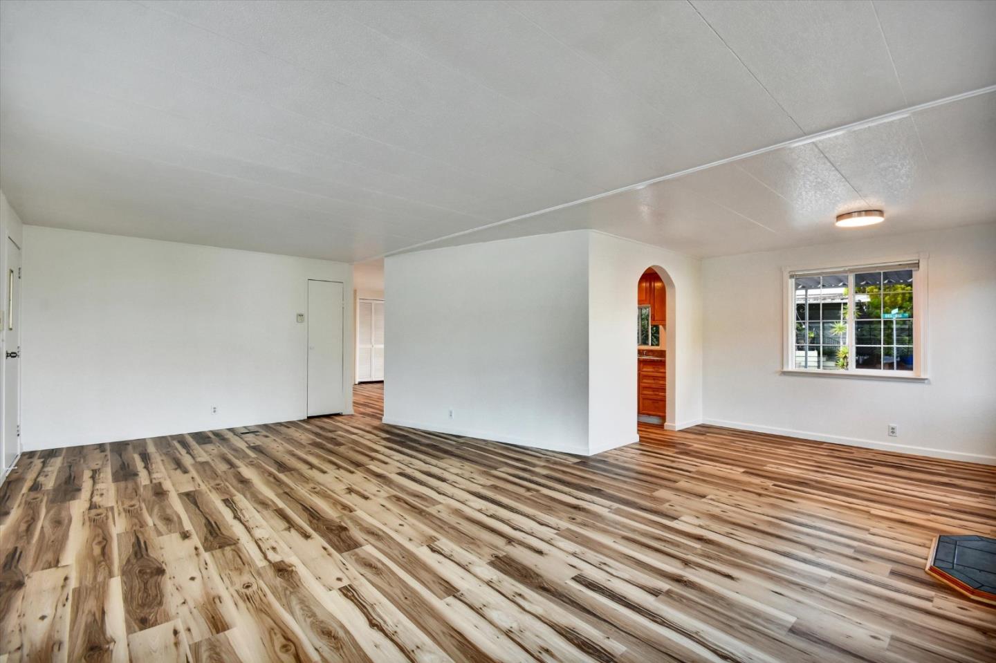 17 Pepperwood Way, Unit 17 Soquel, CA 95073 - Photo 6 of 56 a view of empty room with wooden floor and window