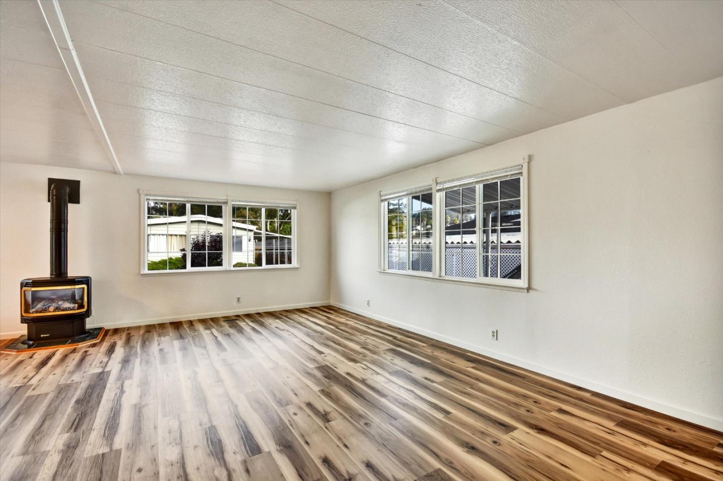17 Pepperwood Way, Unit 17 Soquel, CA 95073 - Photo 9 of 56 a view of empty room with wooden floor and windows