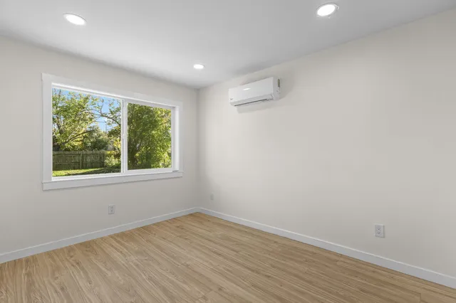 a white toilet sitting next to a shower